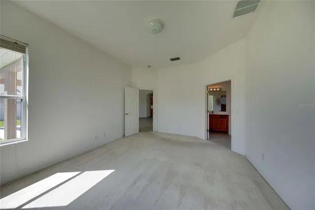 a bathroom with a sink double vanity mirror and a bathtub
