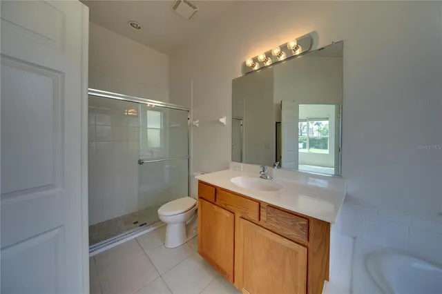a large kitchen with a refrigerator a sink and dishwasher