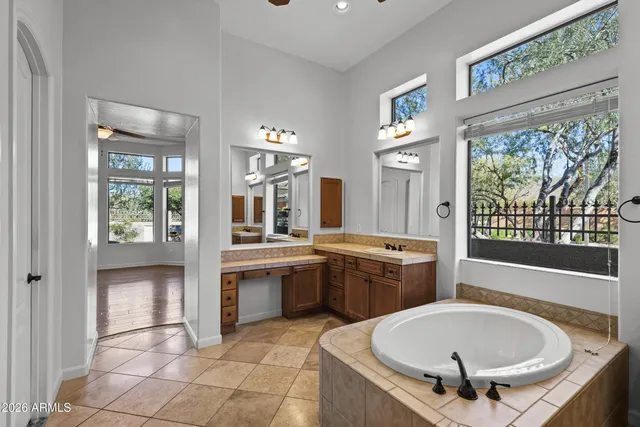 a large white kitchen with a large window
