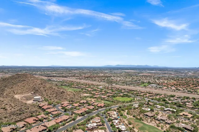 an aerial view of residential building and trees