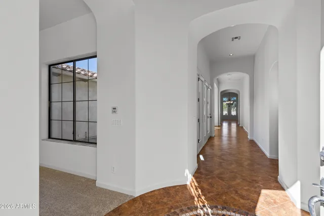 wooden floor with white walls