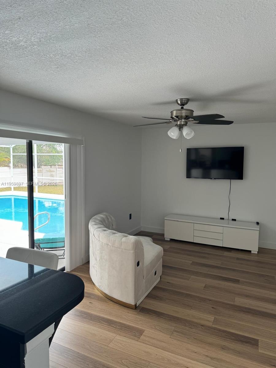 2359 Kings Crest Road Kissimmee, FL 34744 - Photo 13 of 18 a living room with furniture and a flat screen tv