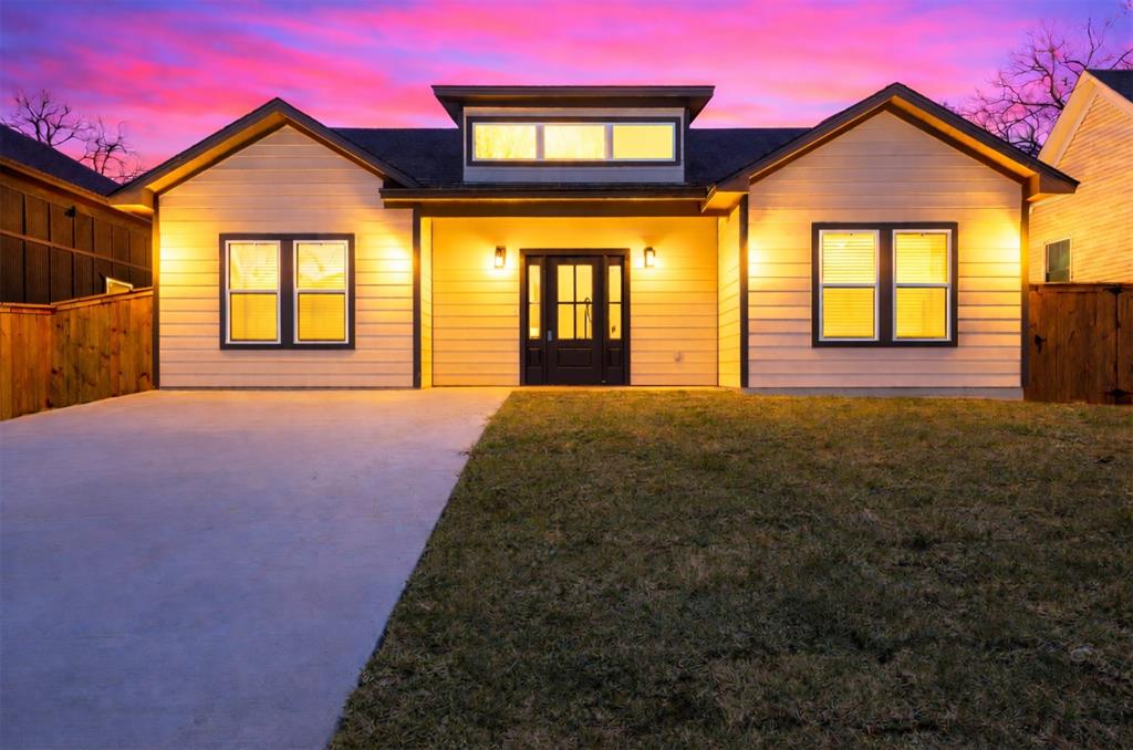 a front view of a house with large windows
