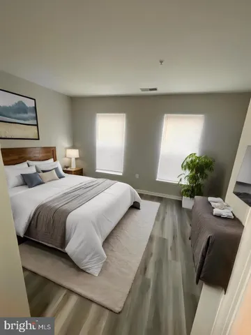 a bedroom with a bed and window