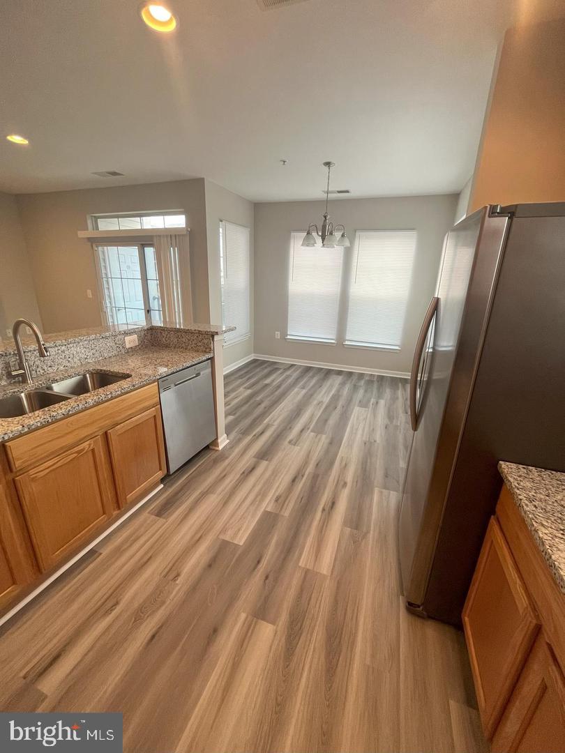 1321 Karen Boulevard, Unit 302 Capitol Heights, MD 20743 - Photo 5 of 14 a spacious bathroom with a sink and a mirror