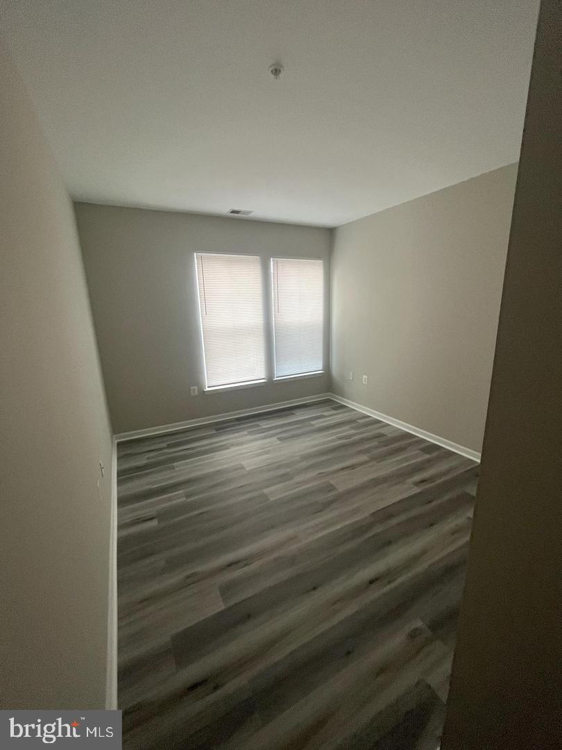 1321 Karen Boulevard, Unit 302 Capitol Heights, MD 20743 - Photo 9 of 14 a view of empty room with window