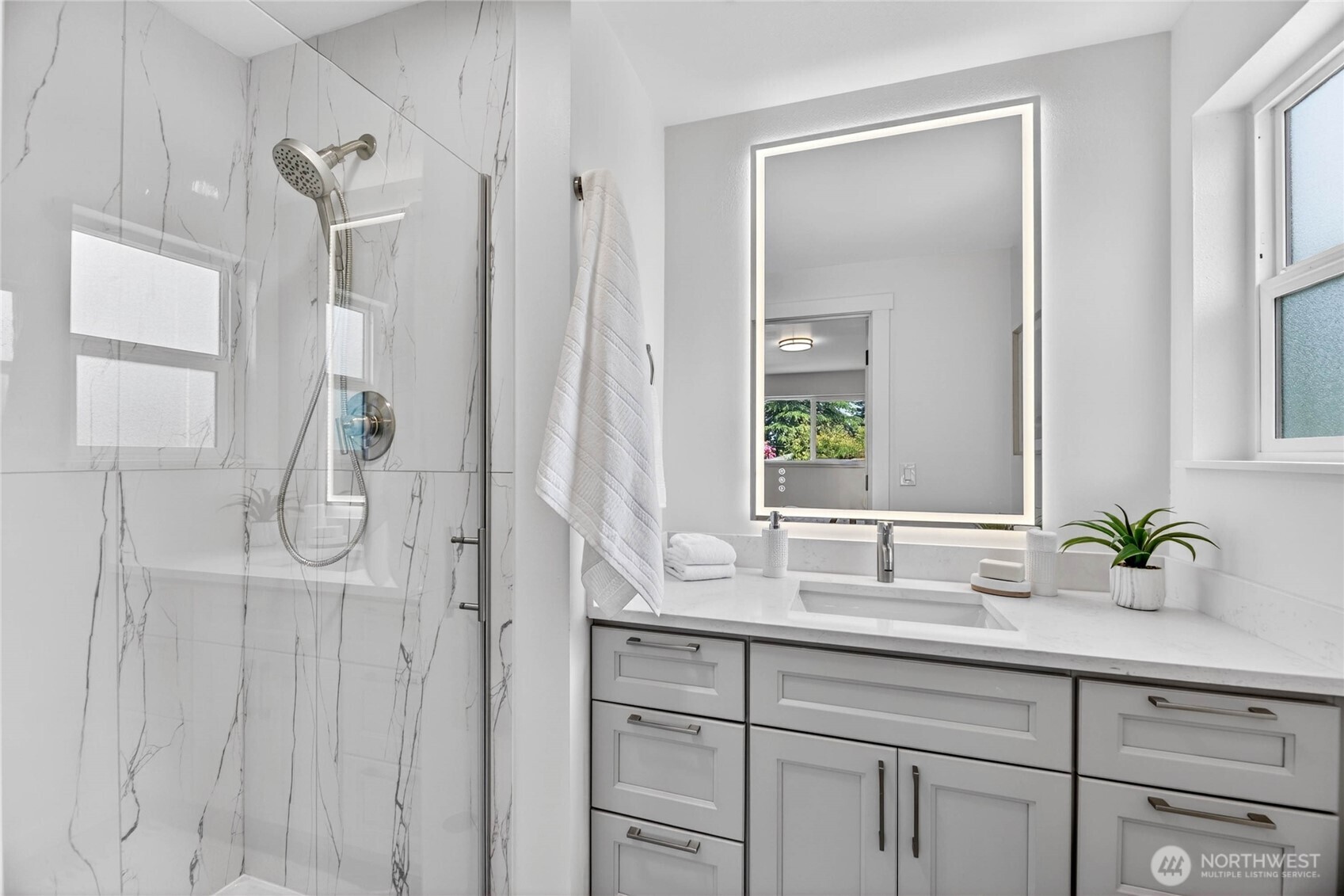 9114 207th Place Southwest Edmonds, WA 98026 - Photo 16 of 36 a bathroom with a double vanity sink and a mirror