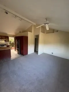 a view of a livingroom and a kitchen