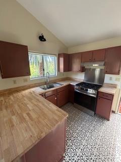 2479 Fordyce Road Ojai, CA 93023 - Photo 6 of 19 a kitchen with stainless steel appliances a sink a stove a refrigerator and cabinets