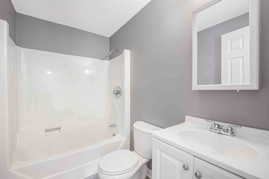 1475 Braley Road, Unit 22 New Bedford, MA 02745 - Photo 15 of 19 a bathroom with a sink toilet and shower