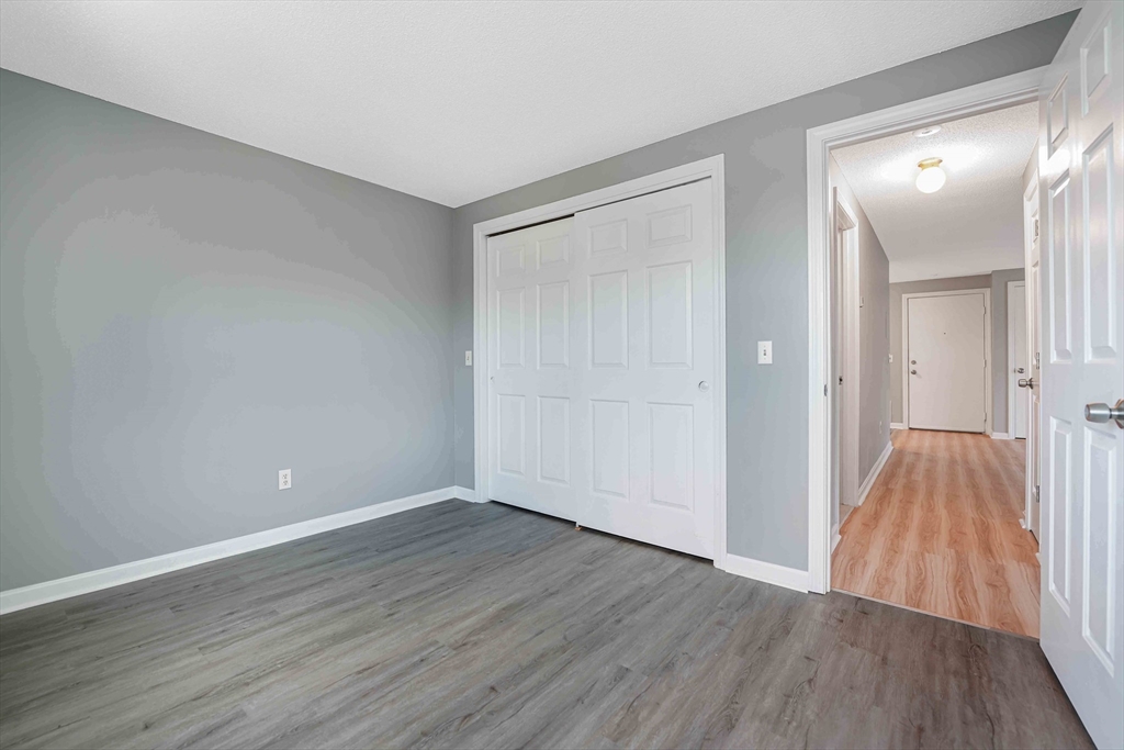 1475 Braley Road, Unit 22 New Bedford, MA 02745 - Photo 17 of 19 wooden floor in an empty room