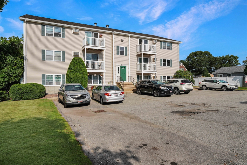 1475 Braley Road, Unit 22 New Bedford, MA 02745 - Photo 18 of 19 a view of a car is parked in front of a building