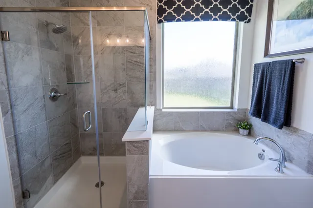 a bathroom with a double vanity sink toilet and a mirror
