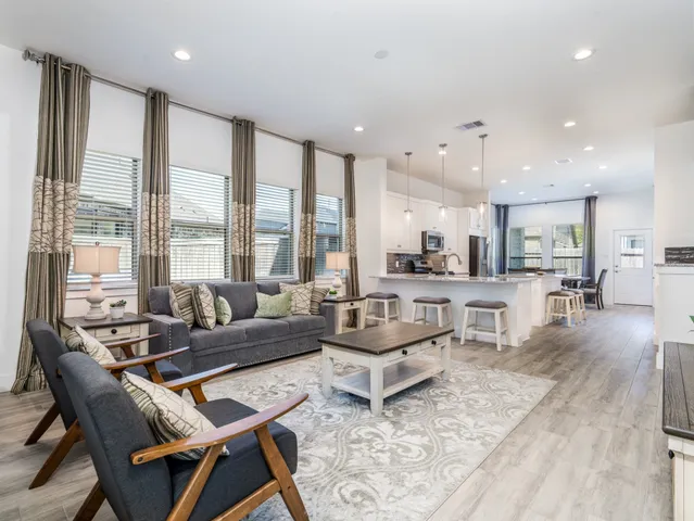 a view of entryway with wooden floor and a livingroom