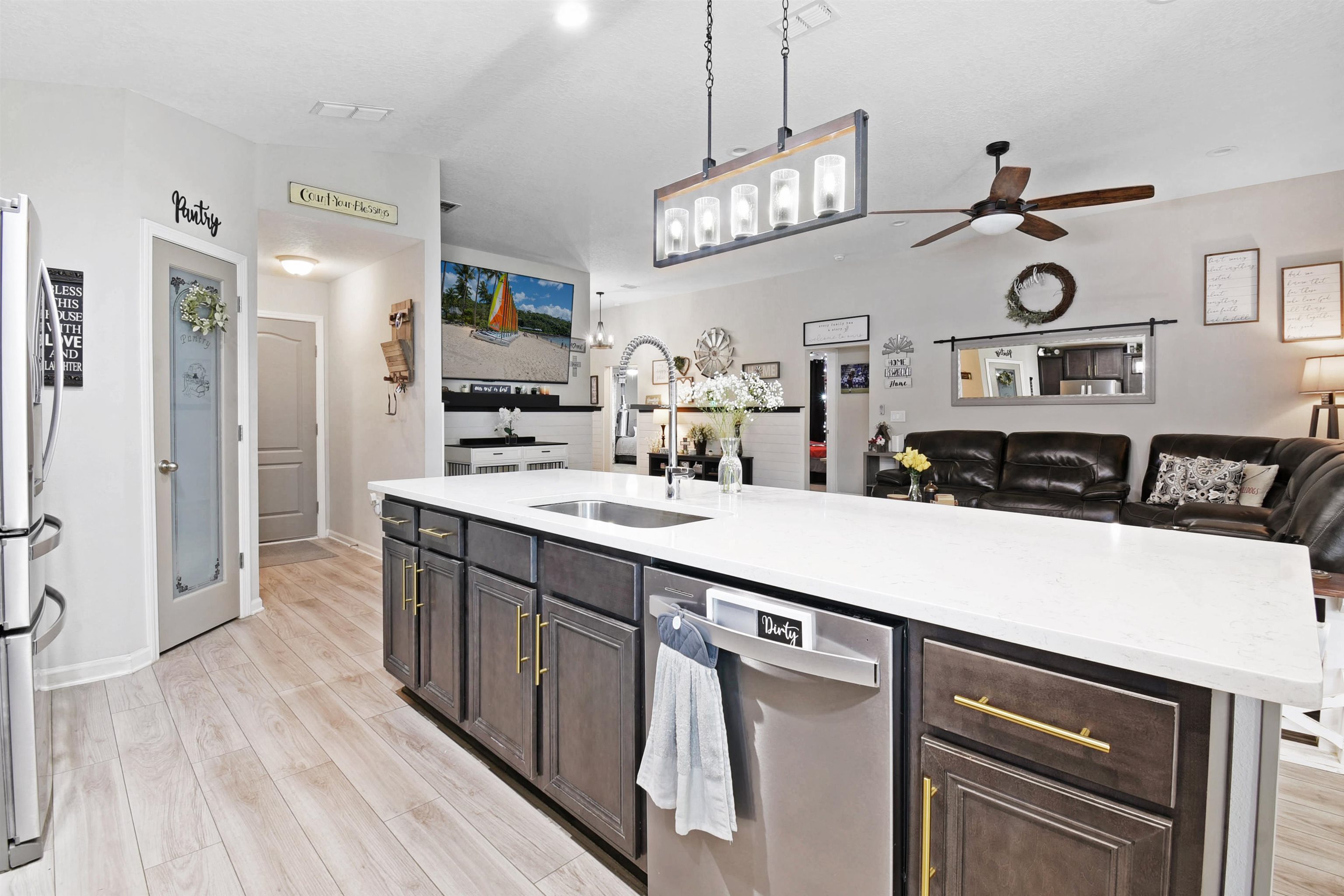 362 South Hamilton Springs Road St. Augustine, FL 32084 - Photo 11 of 37 a kitchen with kitchen island granite countertop a sink and refrigerator