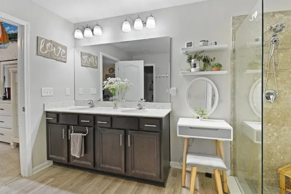 a bathroom with a granite countertop sink a toilet and a mirror