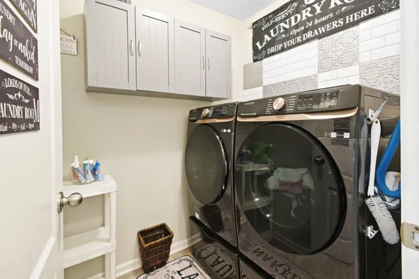 a utility room with dryer and washer