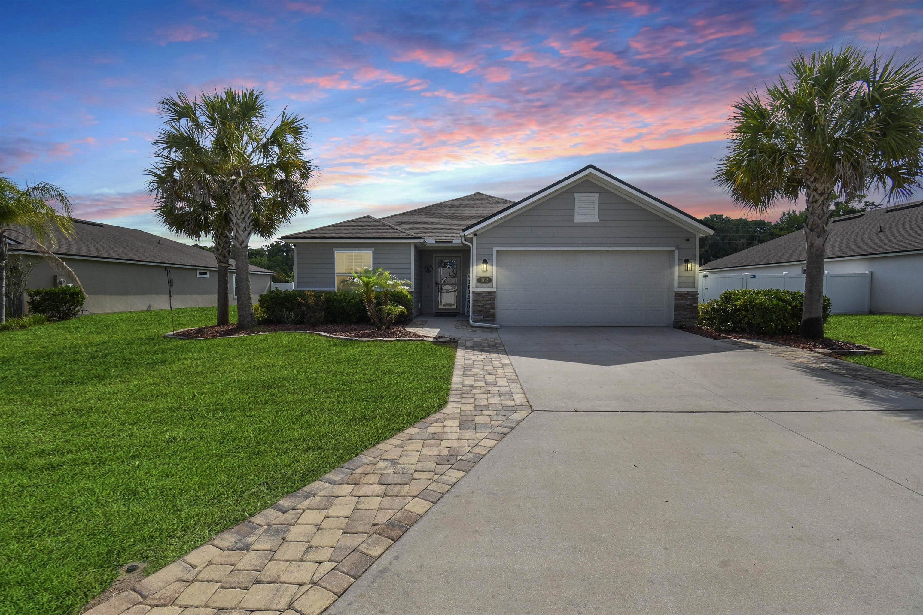 362 South Hamilton Springs Road St. Augustine, FL 32084 - Photo 2 of 37 a front view of house with yard and green space