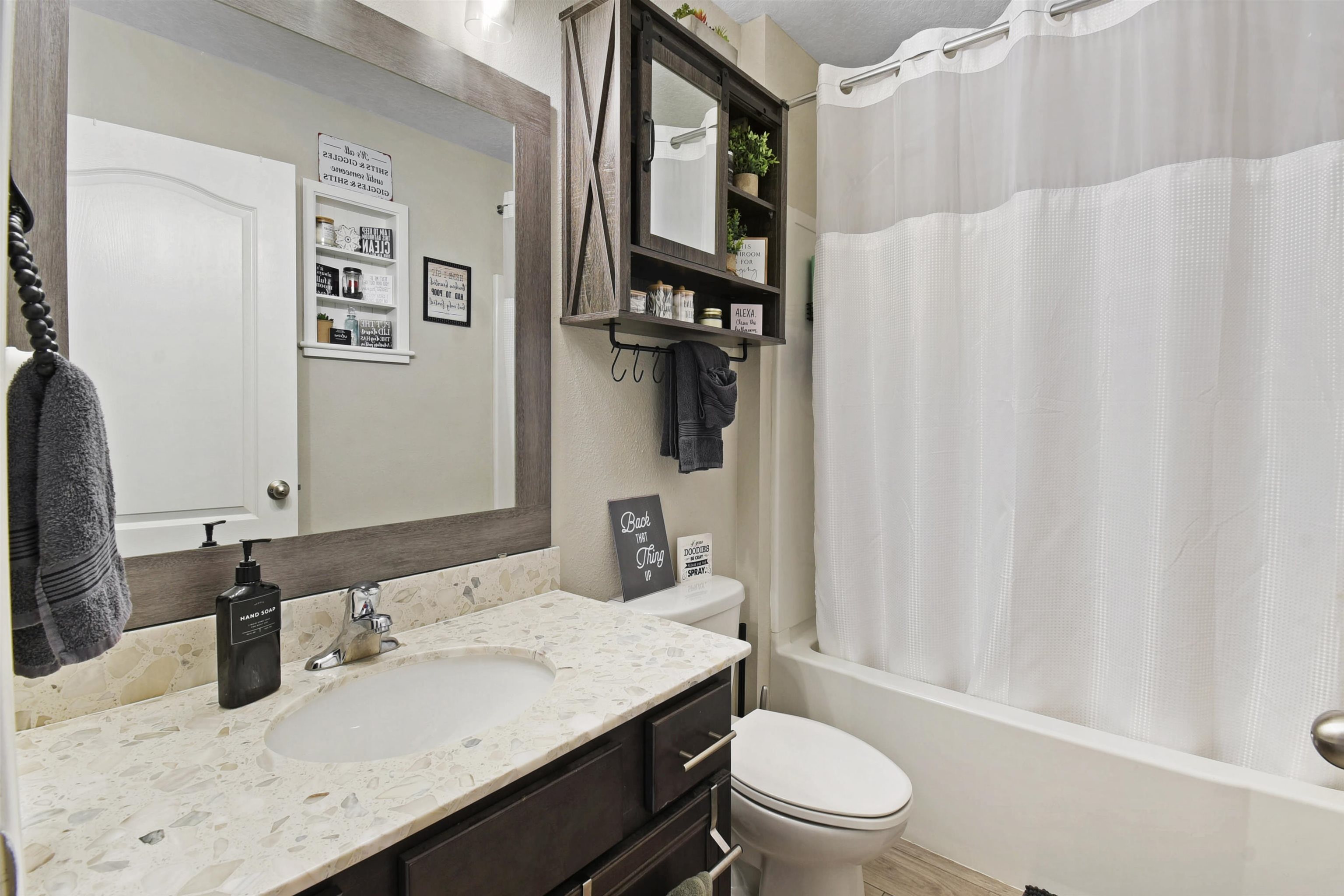 362 South Hamilton Springs Road St. Augustine, FL 32084 - Photo 27 of 37 a bathroom with a granite countertop sink toilet and a mirror