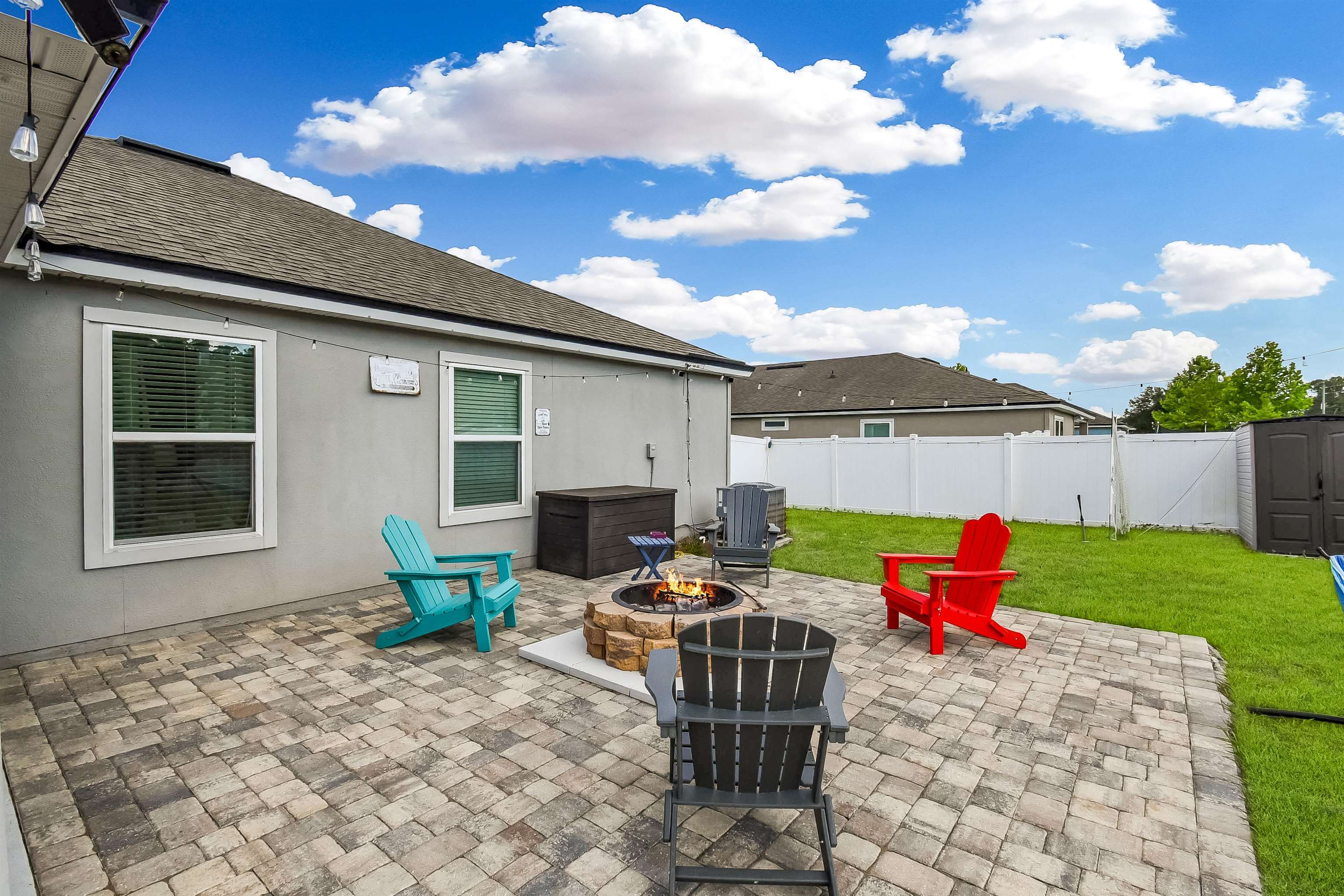362 South Hamilton Springs Road St. Augustine, FL 32084 - Photo 29 of 37 a backyard of a house with table and chairs