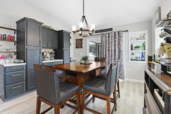 a view of a dining room with furniture window and wooden floor