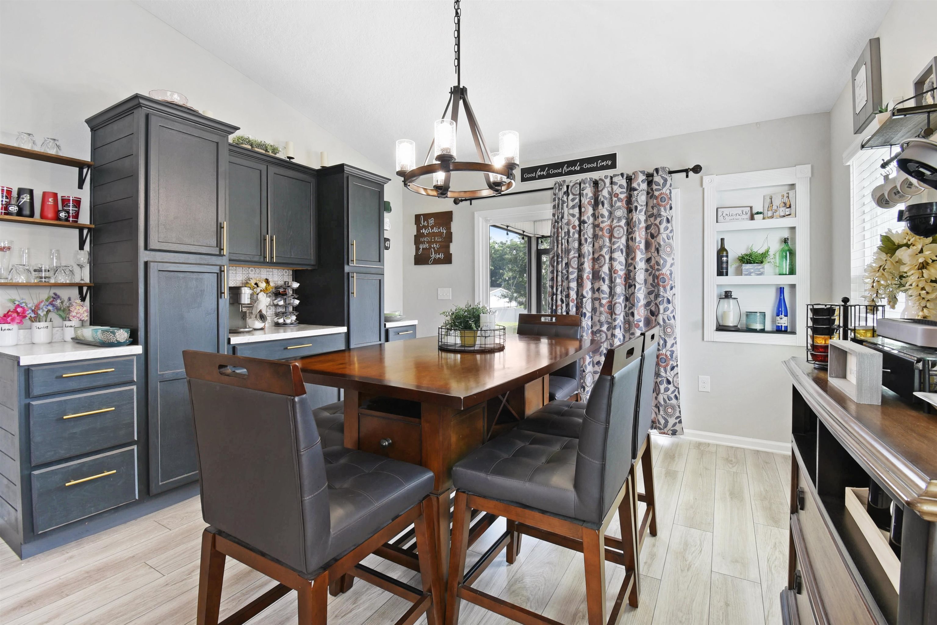 362 South Hamilton Springs Road St. Augustine, FL 32084 - Photo 10 of 37 a view of a dining room with furniture window and wooden floor