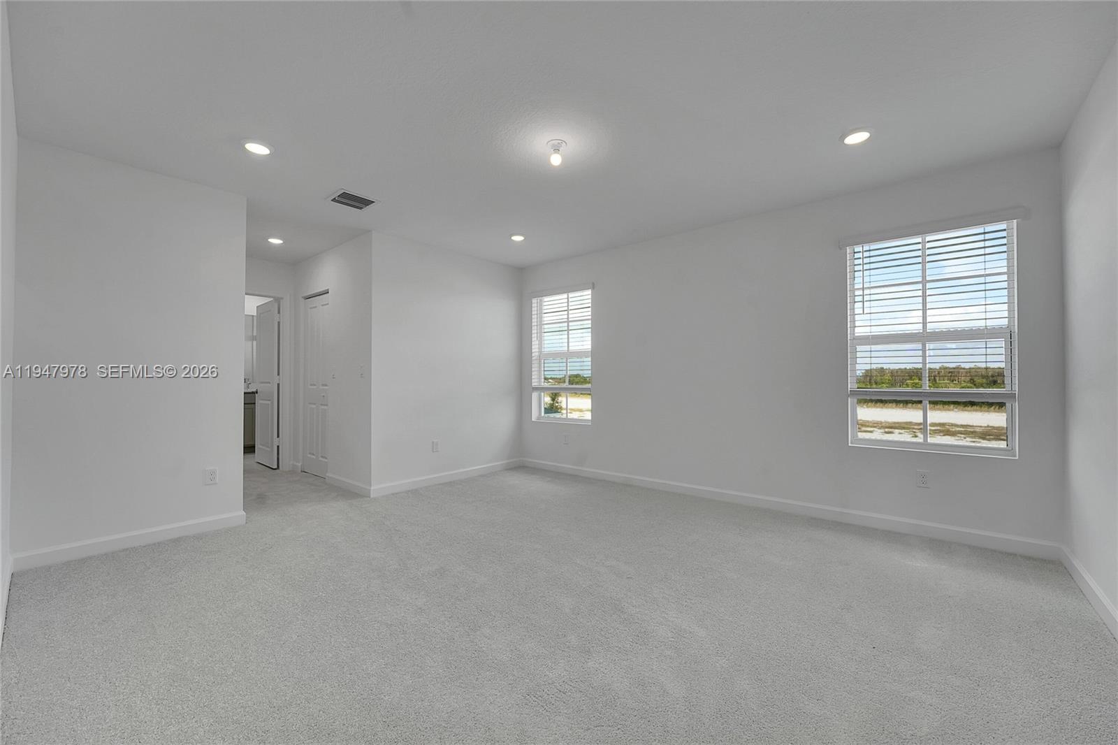 19560 Whispering Creek Road, Unit 19560 Loxahatchee, FL 33470 - Photo 3 of 19 a view of an empty room with a window