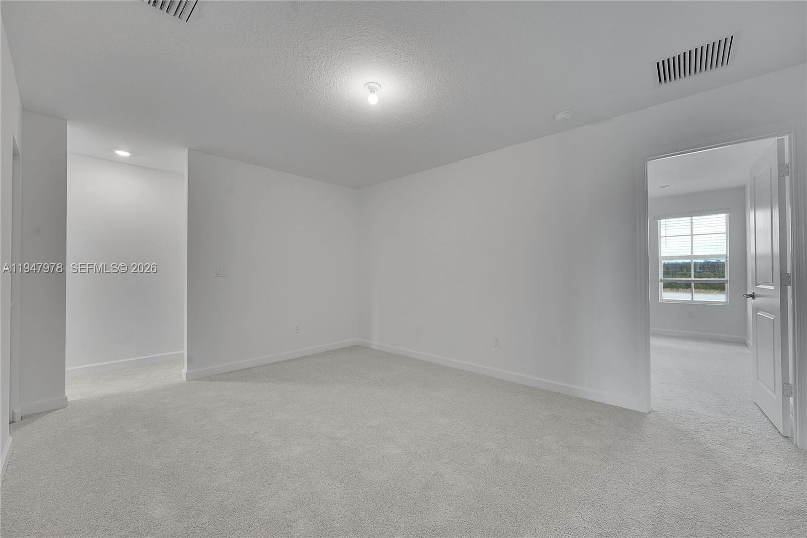 19560 Whispering Creek Road, Unit 19560 Loxahatchee, FL 33470 - Photo 6 of 19 wooden floor in an empty room