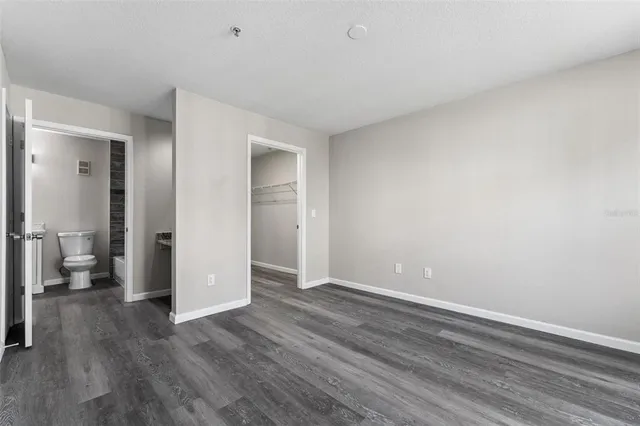 a view of an empty room and wooden floor