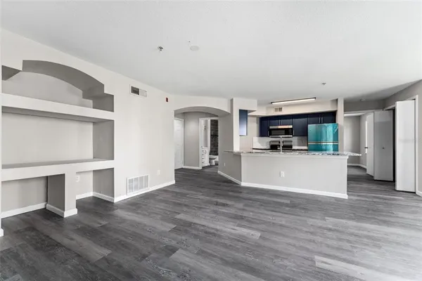 a view of kitchen and kitchen with furniture wooden floor and window