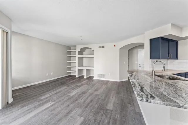 a view of kitchen and wooden floor