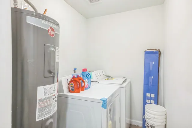 a utility room with a window dryer and washer