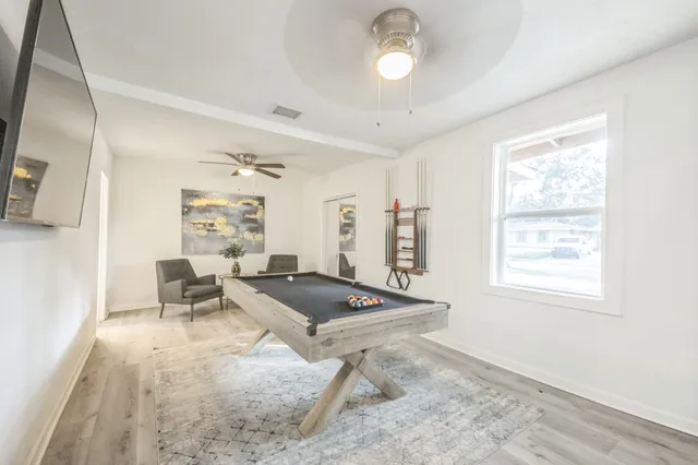 a living room with furniture and a window