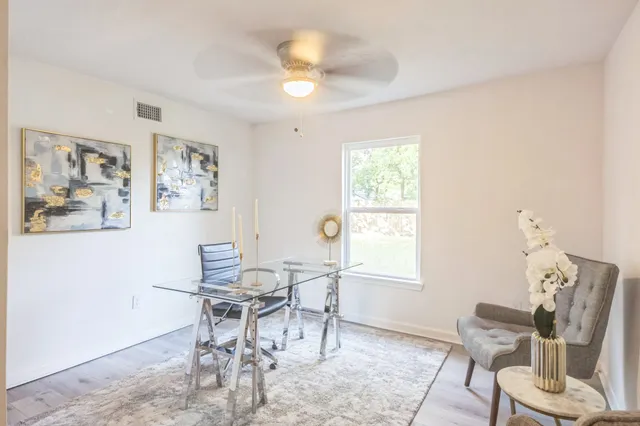 a dining room with furniture and window