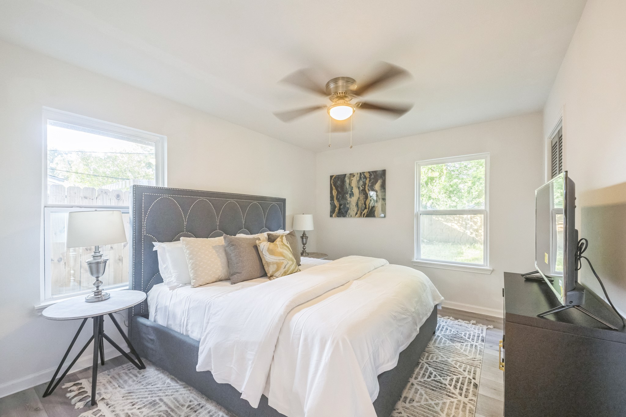 5236 Perry Street Houston, TX 77021 - Photo 7 of 12 a bedroom with a bed tv and a window