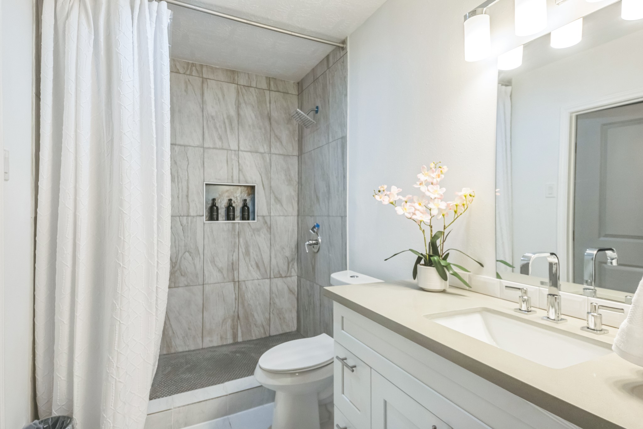5236 Perry Street Houston, TX 77021 - Photo 9 of 12 a bathroom with a granite countertop sink toilet and shower