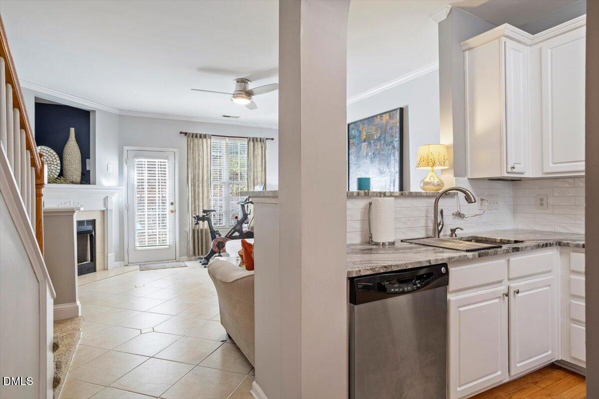 5710 Corbon Crest Lane Raleigh, NC 27612 - Photo 12 of 25 a kitchen with a sink stove and cabinets
