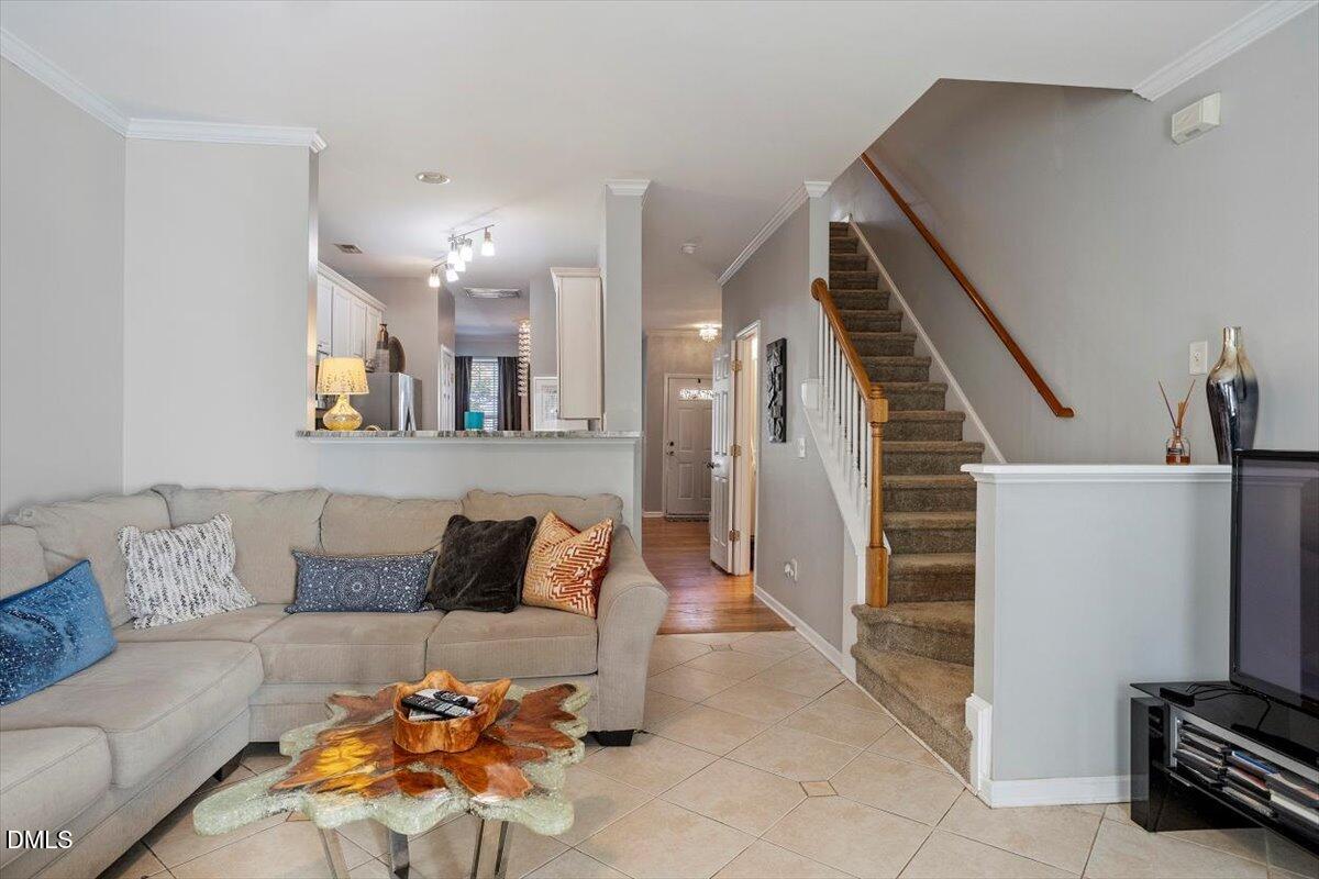 5710 Corbon Crest Lane Raleigh, NC 27612 - Photo 15 of 25 a living room with furniture and a couch