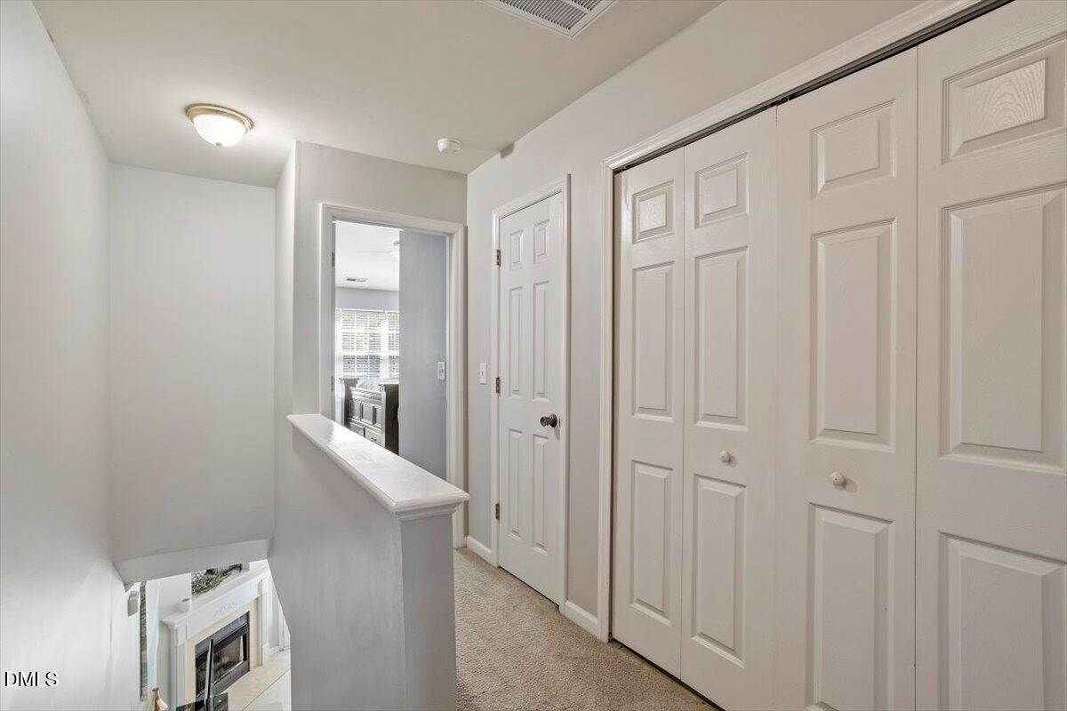 5710 Corbon Crest Lane Raleigh, NC 27612 - Photo 16 of 25 a view of a hallway with closet area