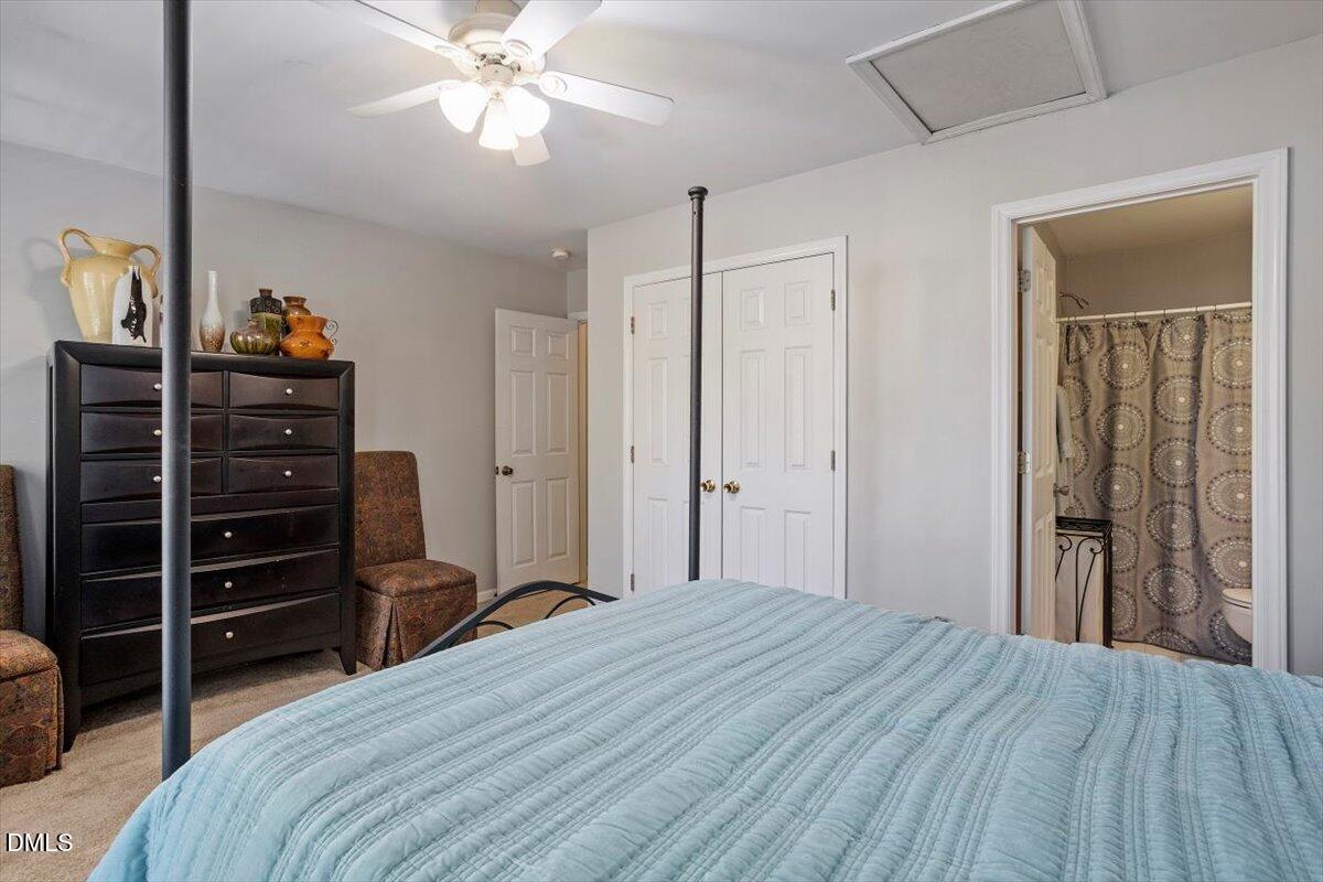 5710 Corbon Crest Lane Raleigh, NC 27612 - Photo 22 of 25 a bedroom with a bed and a closet
