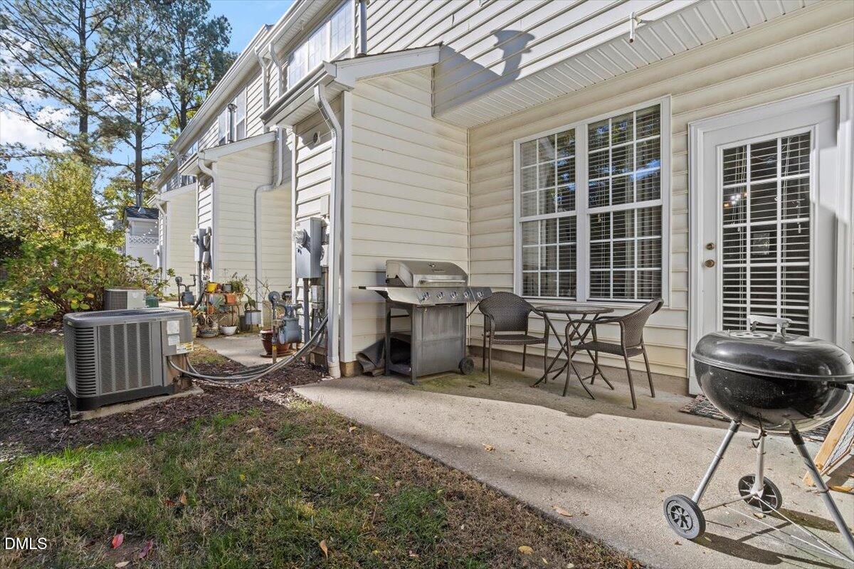 5710 Corbon Crest Lane Raleigh, NC 27612 - Photo 24 of 25 a view of a chairs and table in backyard