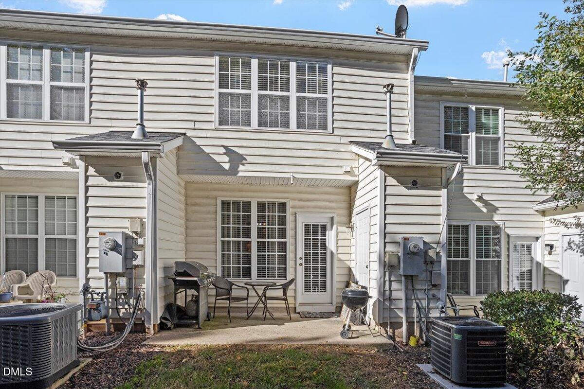 5710 Corbon Crest Lane Raleigh, NC 27612 - Photo 25 of 25 a front view of a house with a patio