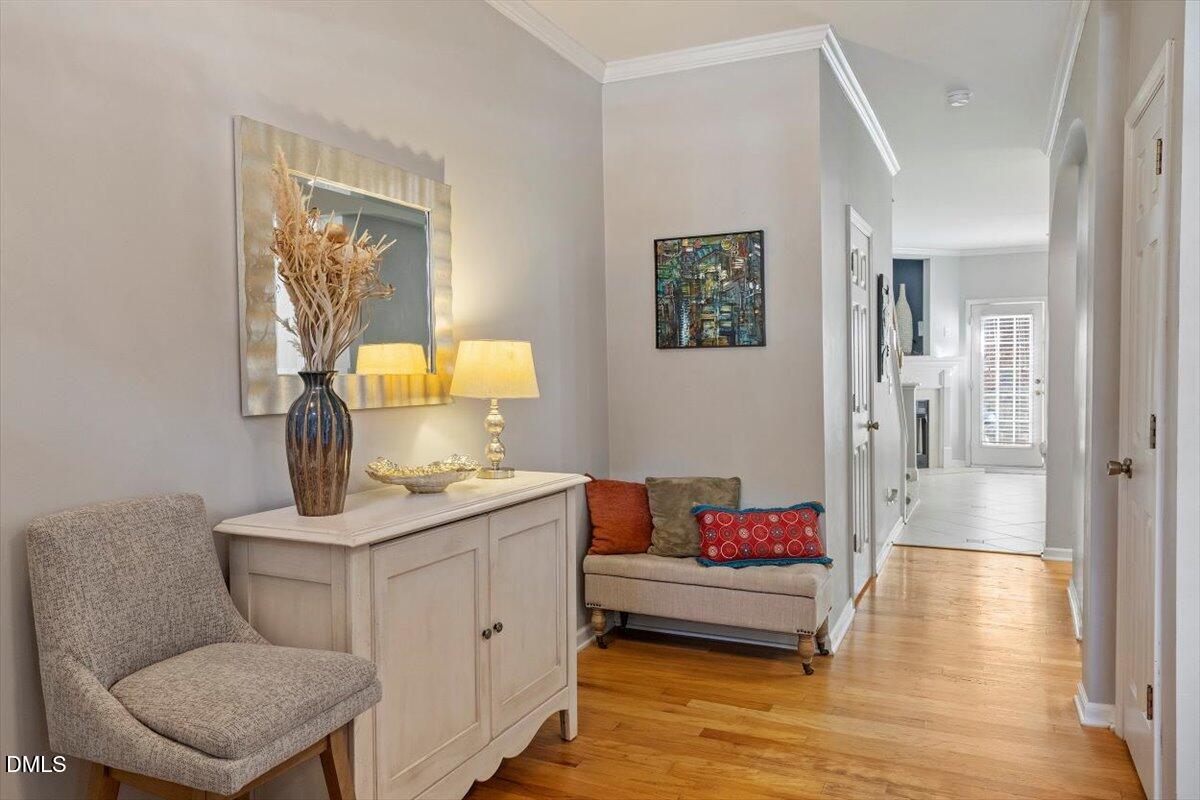 5710 Corbon Crest Lane Raleigh, NC 27612 - Photo 4 of 25 a living room with furniture and a wooden floor
