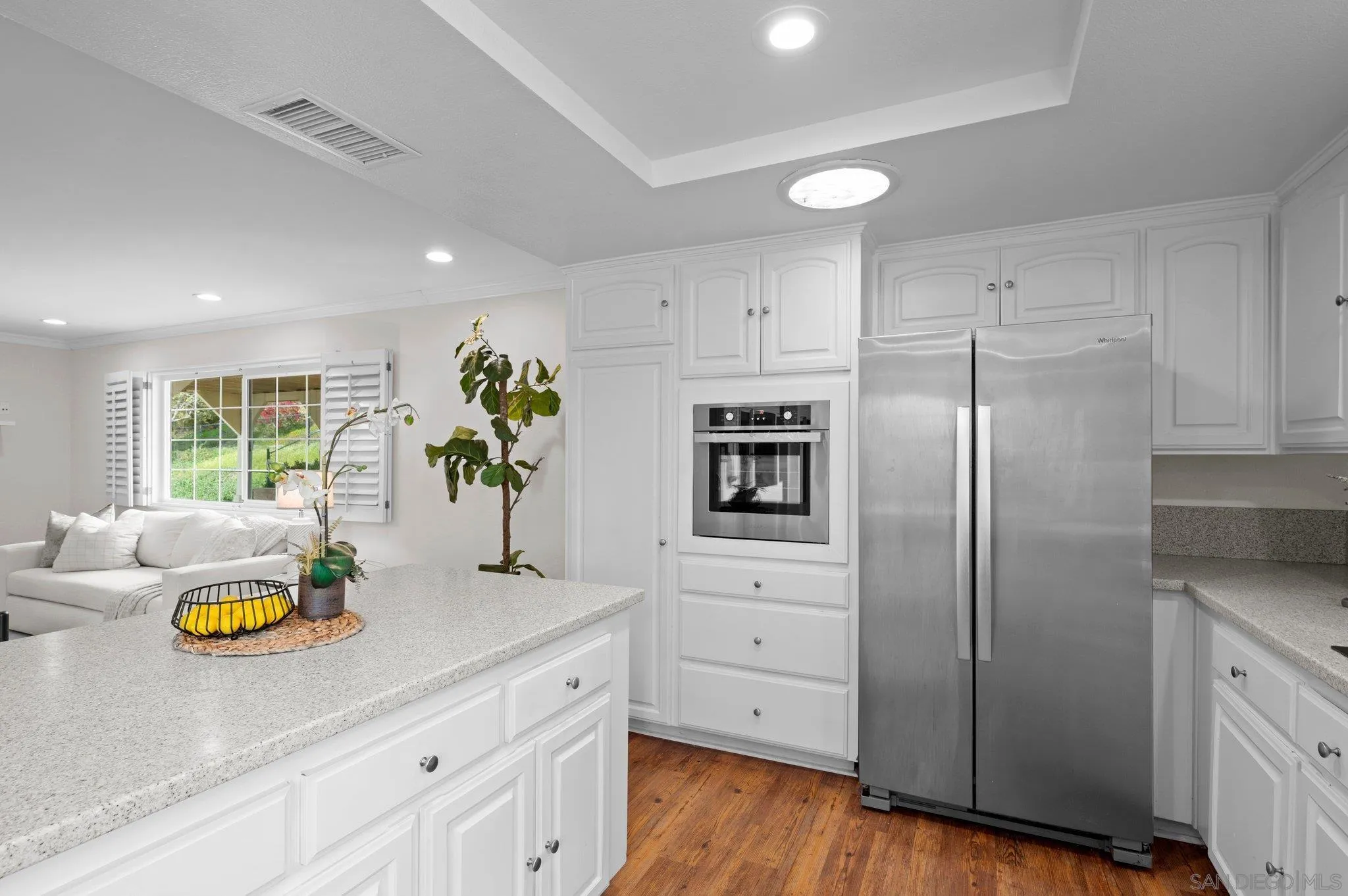 1852 Foxfire Road Fallbrook, CA 92028 - Photo 13 of 53 a kitchen with stainless steel appliances a refrigerator sink and wooden floor