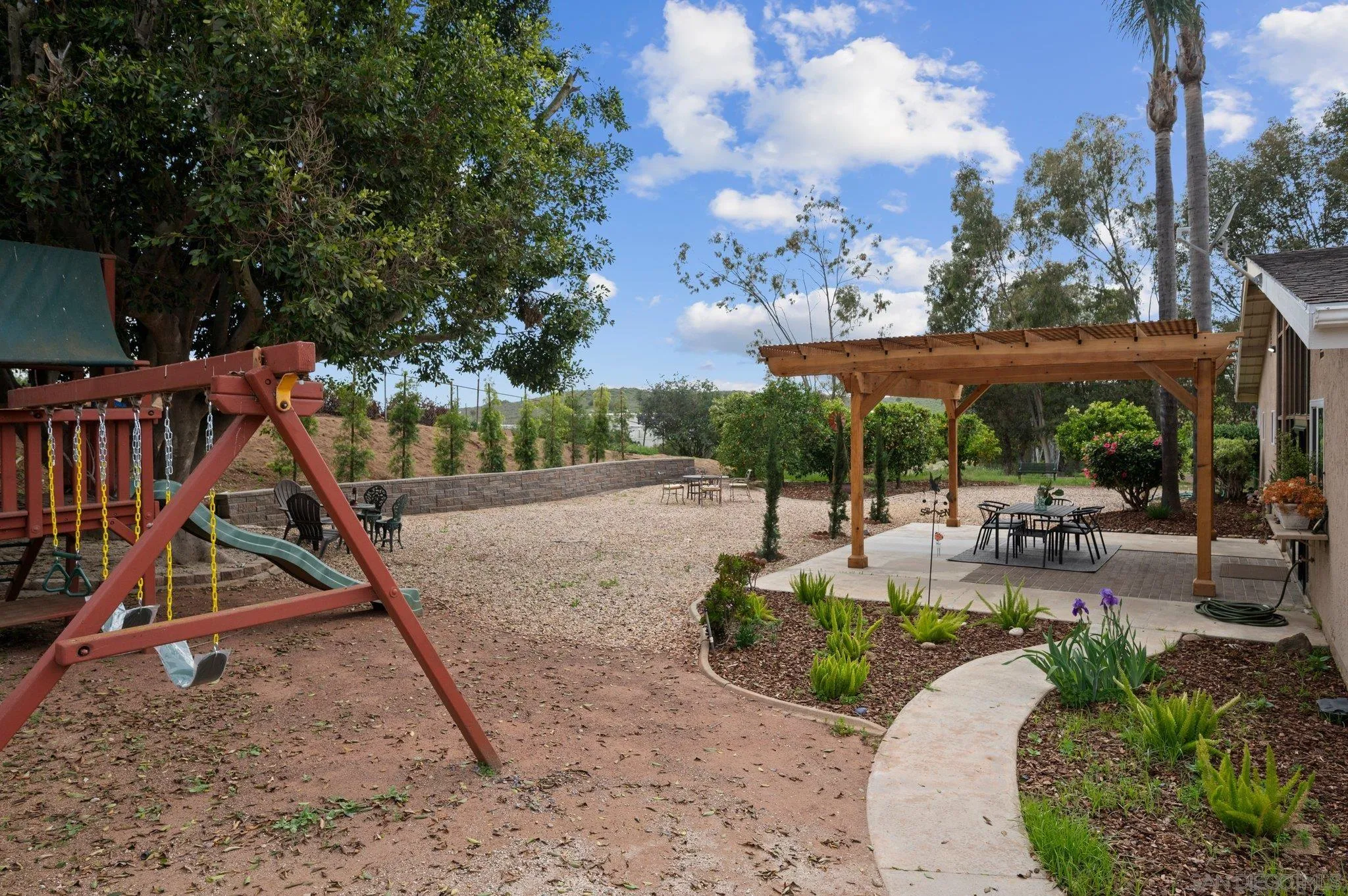 1852 Foxfire Road Fallbrook, CA 92028 - Photo 22 of 53 a view of a patio with a table and chairs