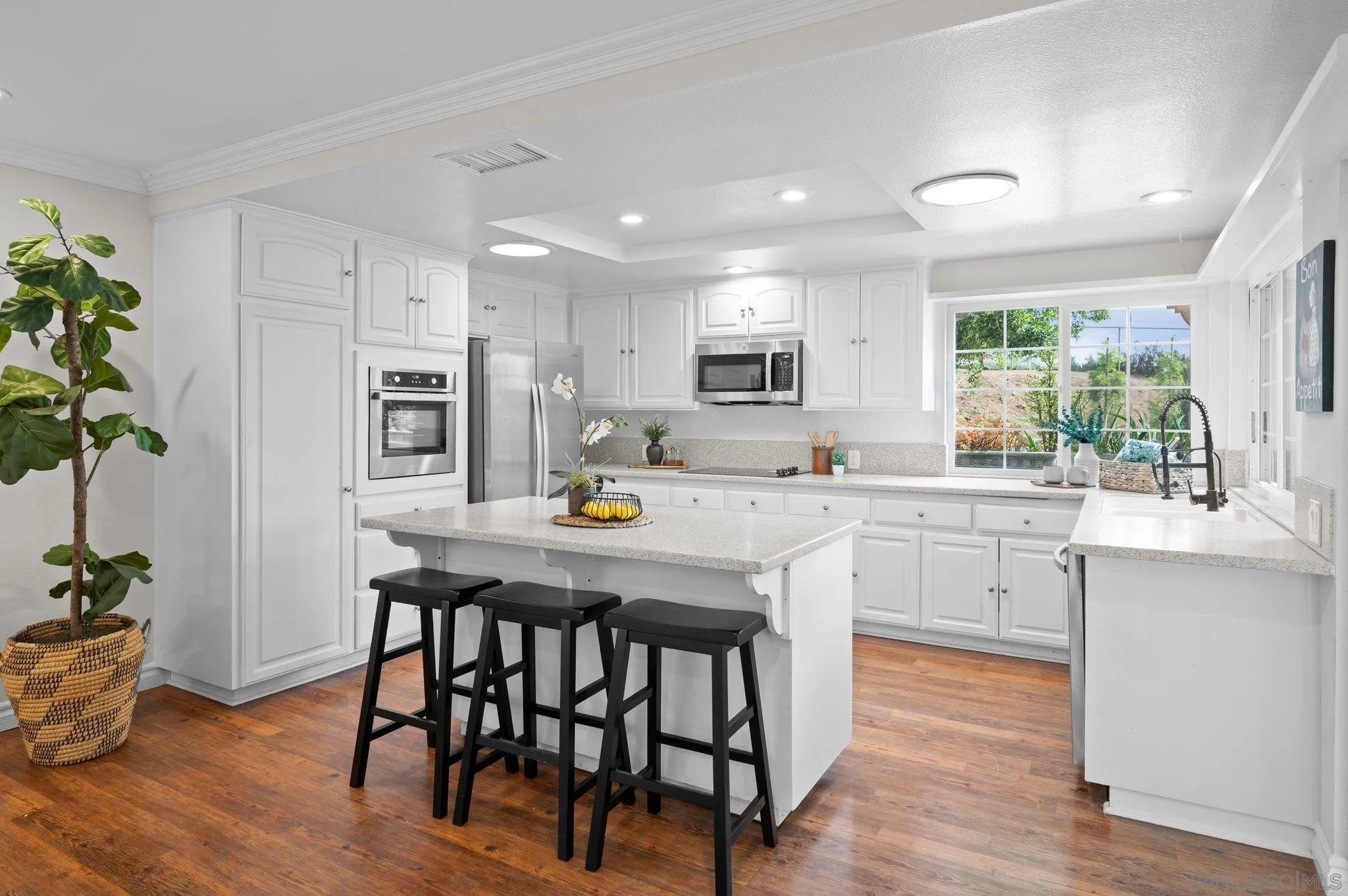 1852 Foxfire Road Fallbrook, CA 92028 - Photo 5 of 53 a kitchen with stainless steel appliances a white table chairs refrigerator and sink