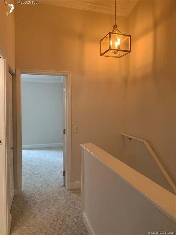 3129 Southeast Indian Street, Unit 3 Stuart, FL 34997 - Photo 6 of 10 a view of a room with empty racks