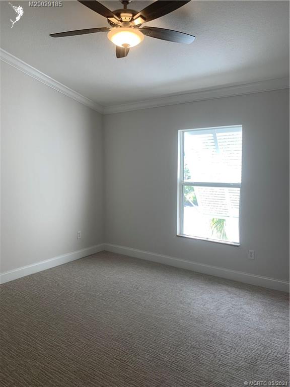 3129 Southeast Indian Street, Unit 3 Stuart, FL 34997 - Photo 7 of 10 an empty room with a window