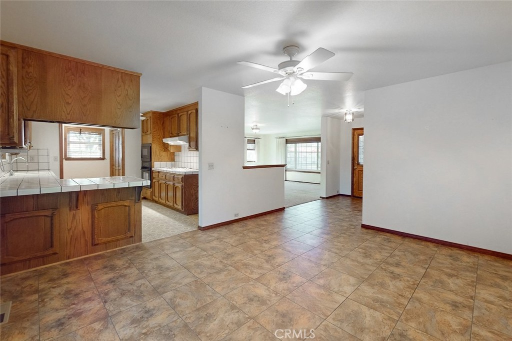510 Indiana Street Gridley, CA 95948 - Photo 12 of 45 a view of a kitchen with a sink cabinet window and a kitchen counter top space