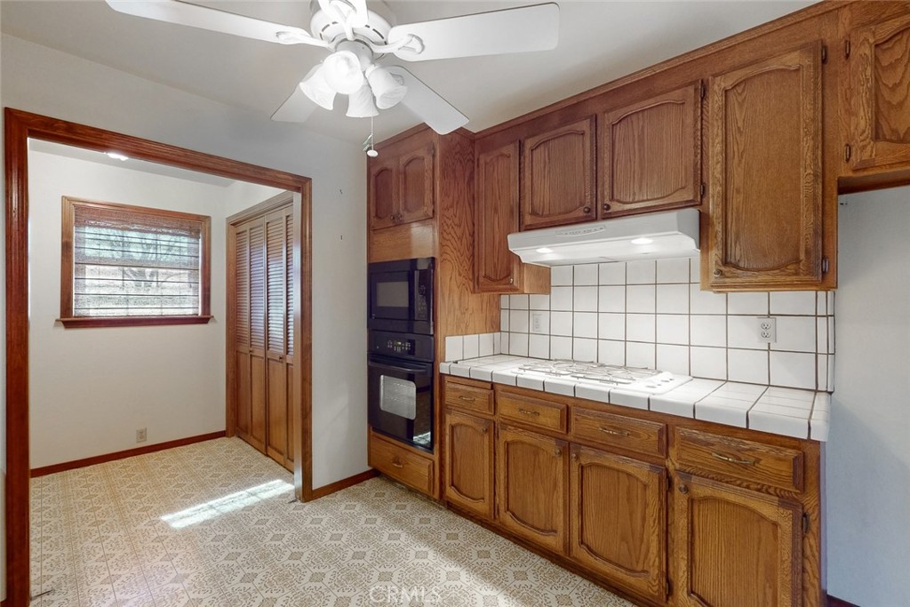 510 Indiana Street Gridley, CA 95948 - Photo 13 of 45 a kitchen with cabinets and window